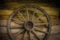 Cartwheel at the old sraw wall of a house Royalty Free Stock Photo