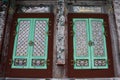 Carved art wooden window and antique wood door in ancient korean architecture of daeungjeon main hall Yonggung shrine at Haedong