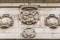 Carved canonic and heraldic shields in Toledo Cathedral facade. Toledo, Spain.