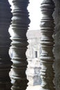 Carved columns, rail-posts, on window openings in Angkor Wat Temple, Siem reap, Cambodia. Are executed manually many centuries ag Royalty Free Stock Photo