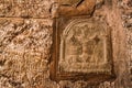 Carved cross embedded in wall of Church of Holy Sepulcher