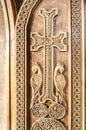 Carved cross on the front wooden door in the Church Royalty Free Stock Photo