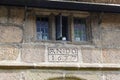 Carved date on historic almshouses in English town. Royalty Free Stock Photo