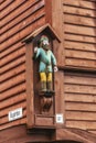 Carved figure of a viking on the side of a wooden building, Bryggen, Bergen, Norway