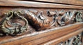 Carved fishes on the drawer chest of the antique wooden furniture Royalty Free Stock Photo