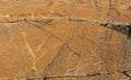 Carved and flattened rough red brown rock