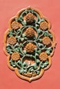 Carved flowers decorate a gate (China)