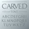 Carved font, engraved on the wall modern realistic letters in roman style, serif