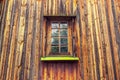Carved frame and window in the old wooden house from boards Royalty Free Stock Photo