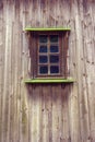 Carved frame and window in the old wooden house from boards Royalty Free Stock Photo