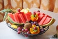 Carved fruits arrangement. Fresh various fruits. Assortment of exotic fruits.