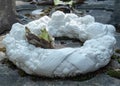 Carved floral wreath on a grave of the Central Cemetery Bruges-Assebroek