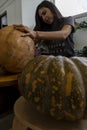 Carved Halloween pumpkin, jack lantern, with carving tools. Spooky laughing, scary head. Royalty Free Stock Photo