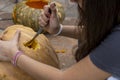 Carved Halloween pumpkin, jack lantern, with carving tools. Spooky laughing, scary head. Royalty Free Stock Photo