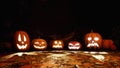 Carved halloween pumpkins in scary forest at night
