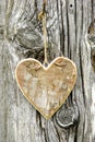 Carved heart hanging on tree