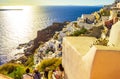 Carved houses and tourists waitng for the sunset Oia Santorini Royalty Free Stock Photo