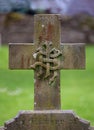 Carved IHS monogram on a headstone cross