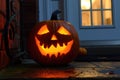 carved and illuminated jack-o-lantern on a doorstep