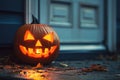 carved and illuminated jack-o-lantern on a doorstep