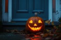 carved and illuminated jack-o-lantern on a doorstep