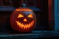 carved and illuminated jack-o-lantern on a doorstep