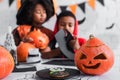 carved jack o lantern near cookies