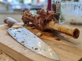 A carved Leg of lamb roasted meat with a knife on a board