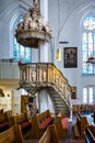 Carved ornate pulpit in St Nikolai Church in Kiel, Germany