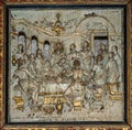 Carved painting depicting Jesus and the disciples around the communion table