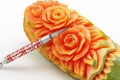 Carved papaya fruit and knife Royalty Free Stock Photo