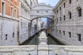 Carved pine cone on Ponte della Paglia with a view of Bridge of Sighs and the Doge`s, Palace in Venice Italy at sunrise Royalty Free Stock Photo