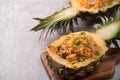 Carved pineapple stuffed with fresh pineapple tomato sauced seafood fried rice Royalty Free Stock Photo