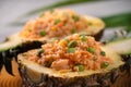 Carved pineapple stuffed with fresh pineapple tomato sauced seafood fried rice Royalty Free Stock Photo