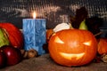 Carved Pumpkin With Candle On Jute Bag.