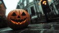 A carved pumpkin, its frightful features prominently displayed, rests before a structure Royalty Free Stock Photo