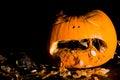 A carved pumpkin looks to be comitting