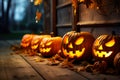 Carved pumpkin in front of a house at night