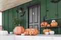 Carved pumpkins on green house stairs, side view Royalty Free Stock Photo