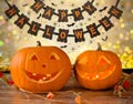 Carved pumpkins and happy halloween garland Royalty Free Stock Photo