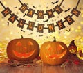 Carved pumpkins and happy halloween garland Royalty Free Stock Photo