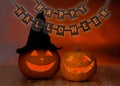 Carved pumpkins and happy halloween garland Royalty Free Stock Photo