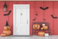 Carved pumpkins near white house door