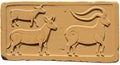 Carved relief on a rectangular stone slab features three animals in side profile. The Royalty Free Stock Photo