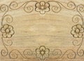 Carved Retro Floral Pattern as Frame on Wooden Background with Copyspace Royalty Free Stock Photo