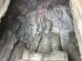 Carved statues in grotto in Longmen Caves Royalty Free Stock Photo