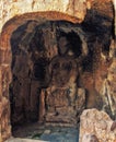 A carved stone Buddha, carved from the rock, Longmen Grottoes an Royalty Free Stock Photo
