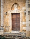 The carved stone entrance of an ancient Italian medieval church Royalty Free Stock Photo