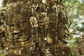 Carved stone faces at ancient temple in Angkor Wat Royalty Free Stock Photo