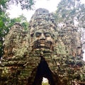 Carved stone faces ancient temple ruin